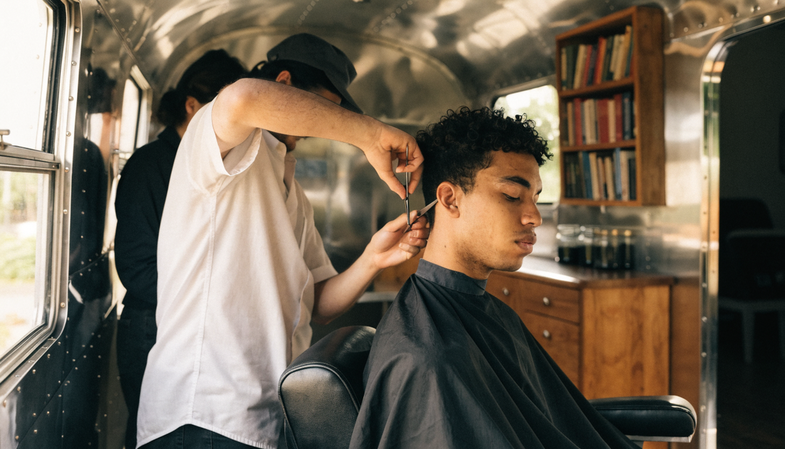 Barber cutting hair inside an Airstream trailer (AI-generated illustration)